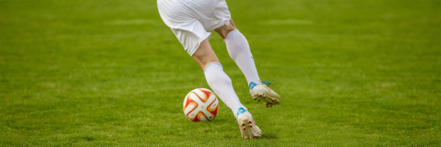 A footballer dribbling the ball