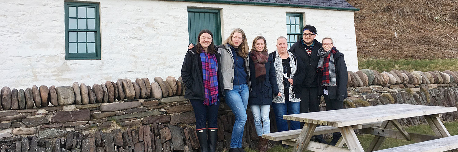 Six QMU students at a cottage maintained by The Landmark Trus