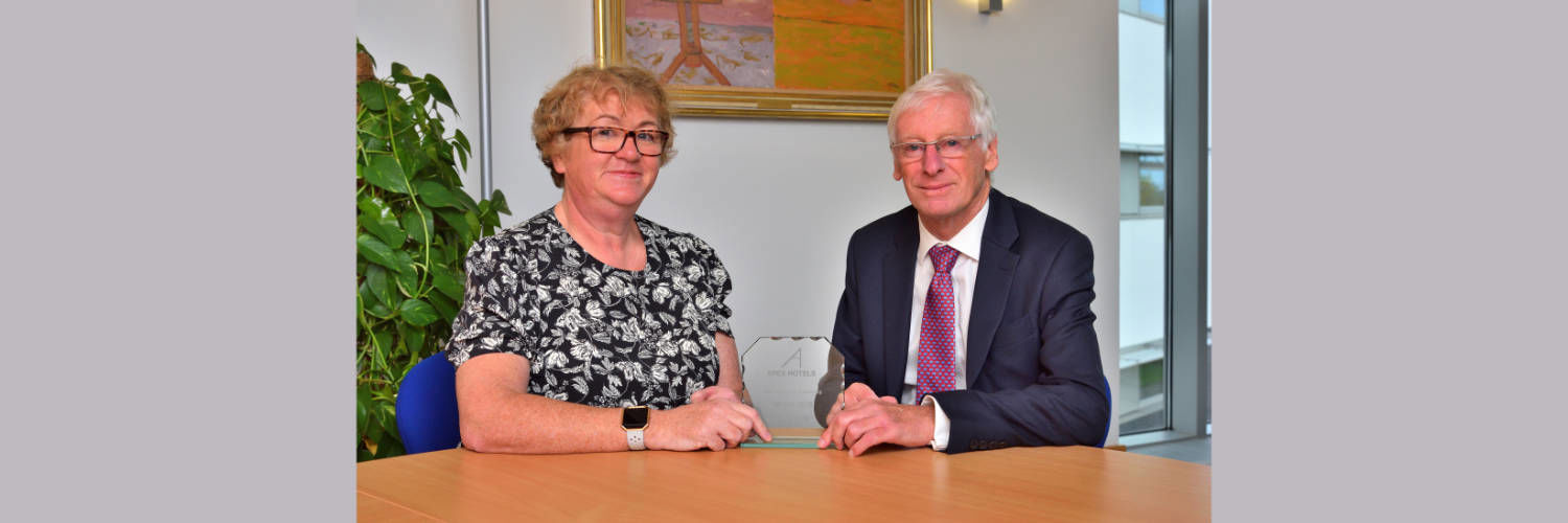 Mary Kelly with founder of APEX Hotels Norman Springford