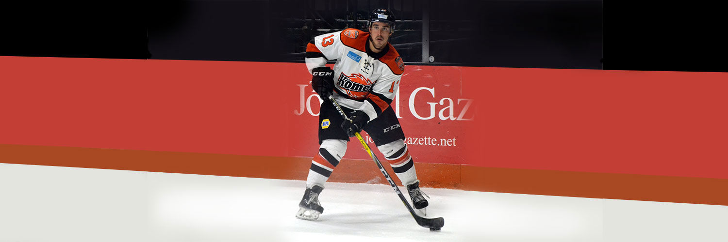 Mike playing ice hockey