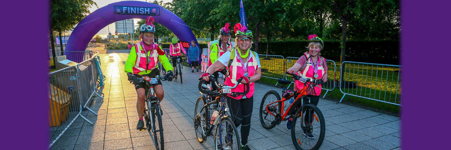 A group of happy women embarking on Ride the Night event