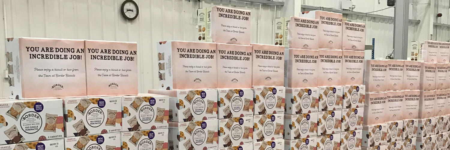 A large wall of biscuit boxes