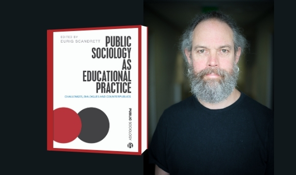 Eurig Scandrett posing with his new book Public Sociology as Education Practice