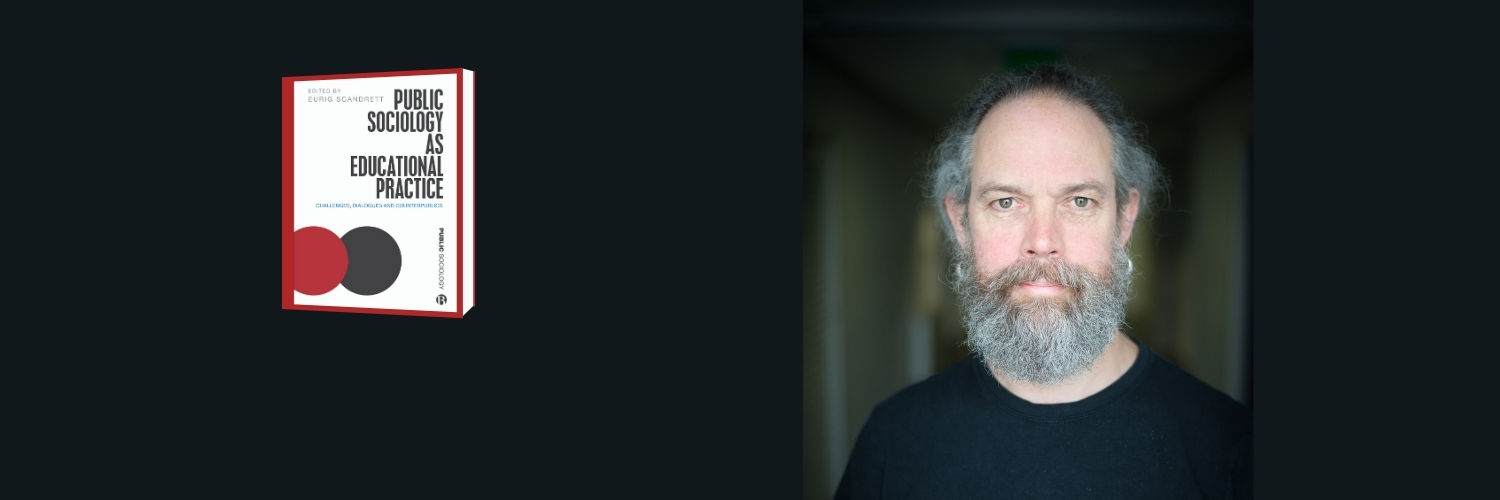 Eurig Scandrett posing with his new book Public Sociology as Education Practice