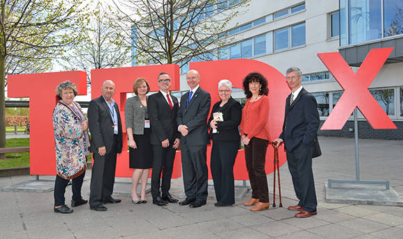 QMU staff and friends with the big Ted-X sign