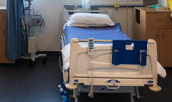 An empty hospital bed