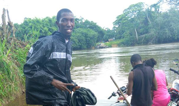 People getting on a boat in Sierra Leone 