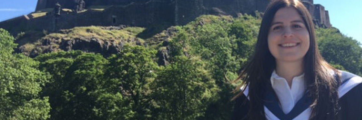 Alexia Mitchell standing next to Edinburgh Castle