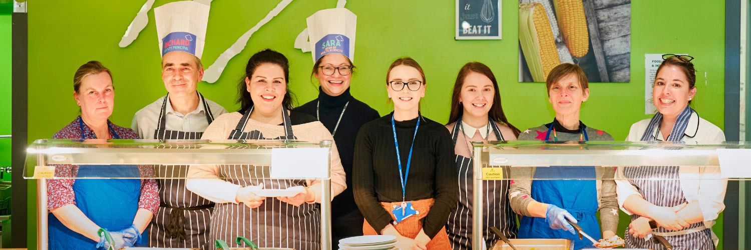 Volunteers serving at the TGIT counter