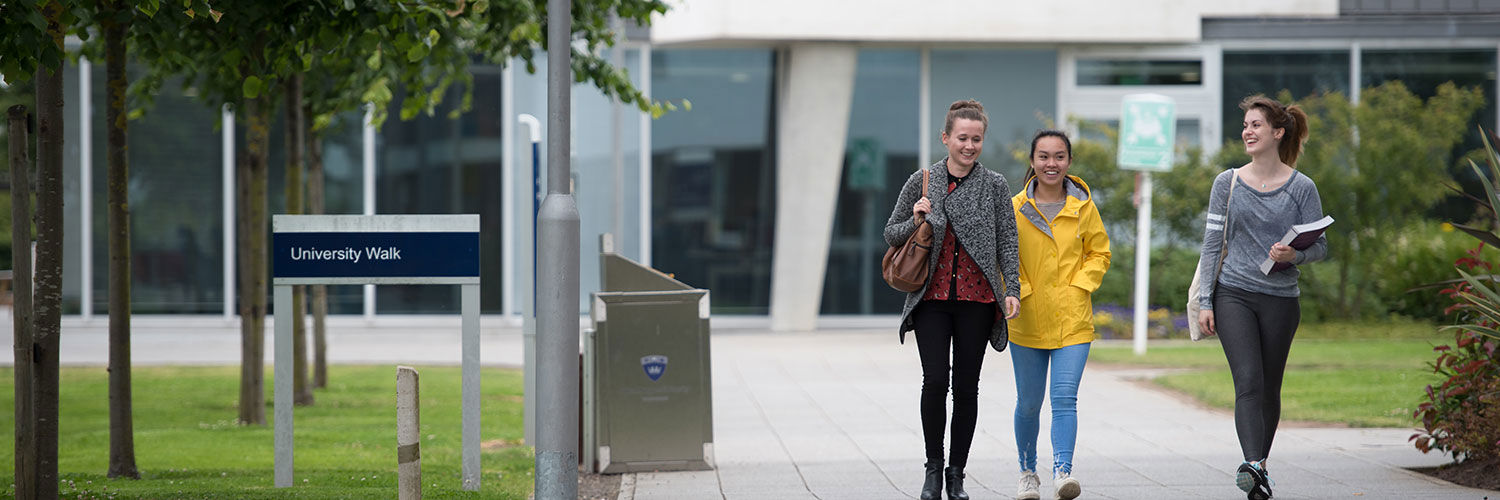 Three students walking on QMU University Campus