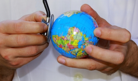 Hand holding a Globe