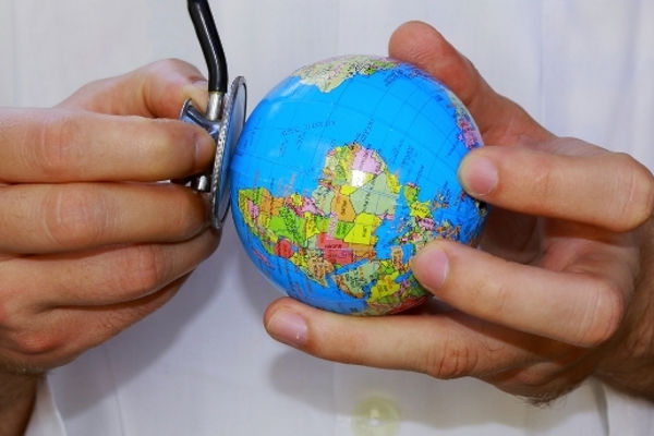 Hand holding a Globe