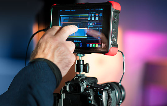 Close up of a high end digital camera with a touch screen for editing