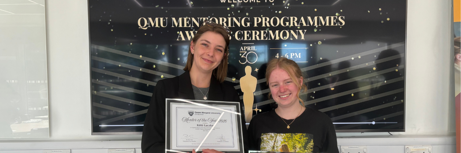Mentor and mentee holding their Employer Mentoring Programme Awards 