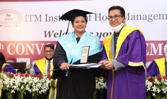 ITM graduate Divya Yatin Shah receives her degree at her graduation ceremony.