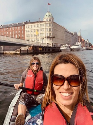 Image of individuals smiling on kayak