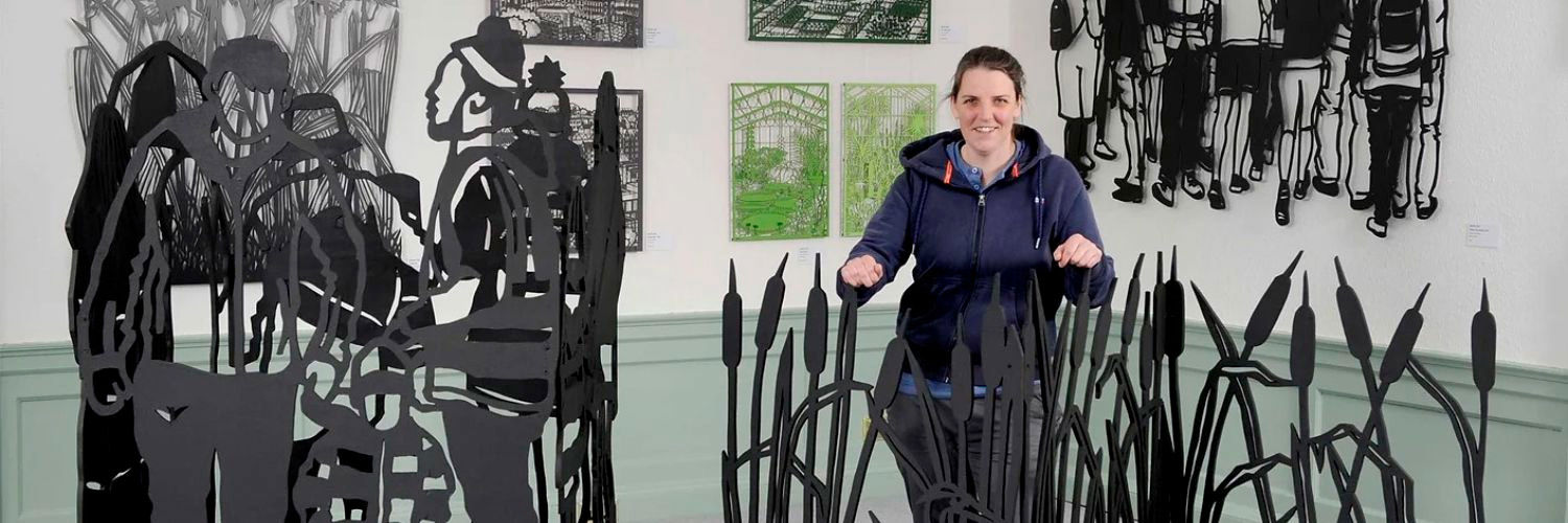 Martha Ellis stood beside her artwork