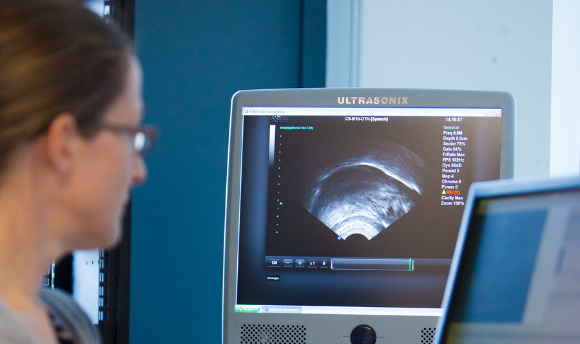 An image showing a QMU staff member using Ultrasonix ultrasound equipment.