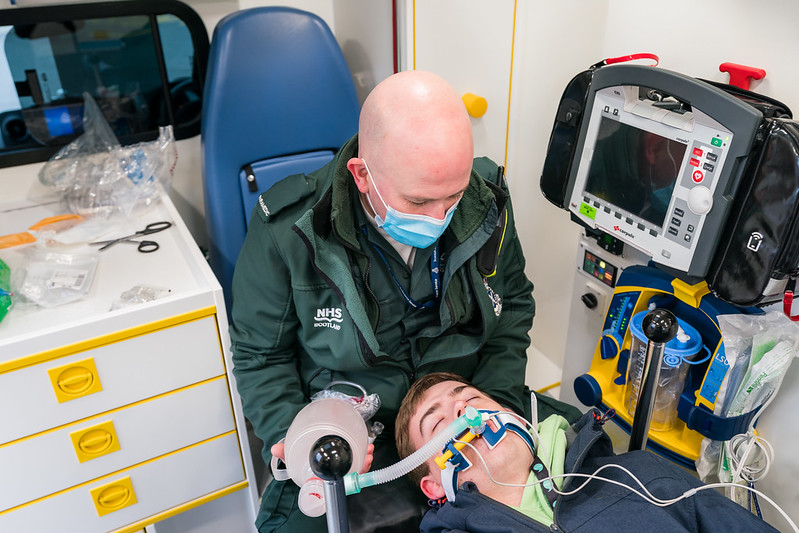 Image of Paramedic performing aid 