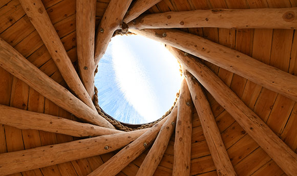 Wooden roof of the Howff at QMU, with a glimpse of blue sky above