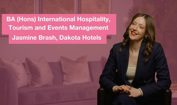 Woman in suit speaking to the camera