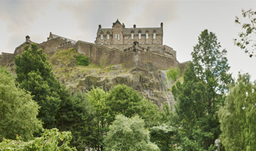 A view of Edinburgh Castle from below in Princes Street Gardens