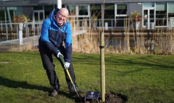 Principal and Vice-Chancellor of Queen Margaret University (QMU), Edinburgh, Sir Paul Grice, planting a tree on the University's grounds in celebration of the Platinum Jubilee of Her Majesty Queen Elizabeth II.