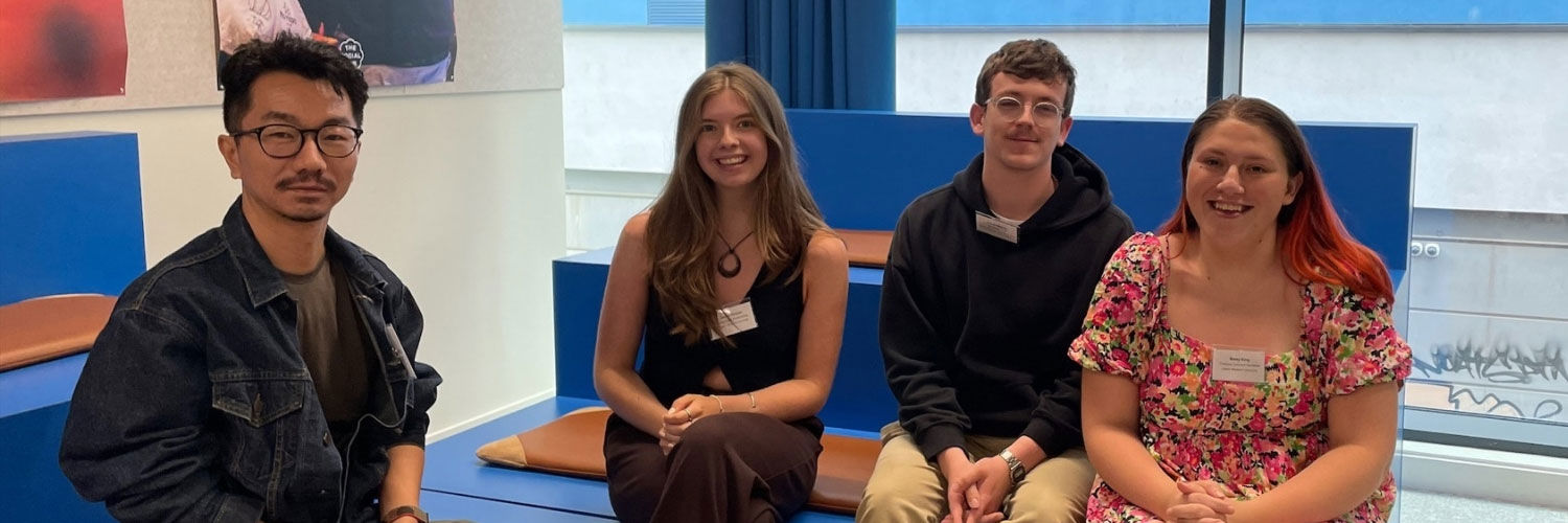 Four students posing for a photo together.