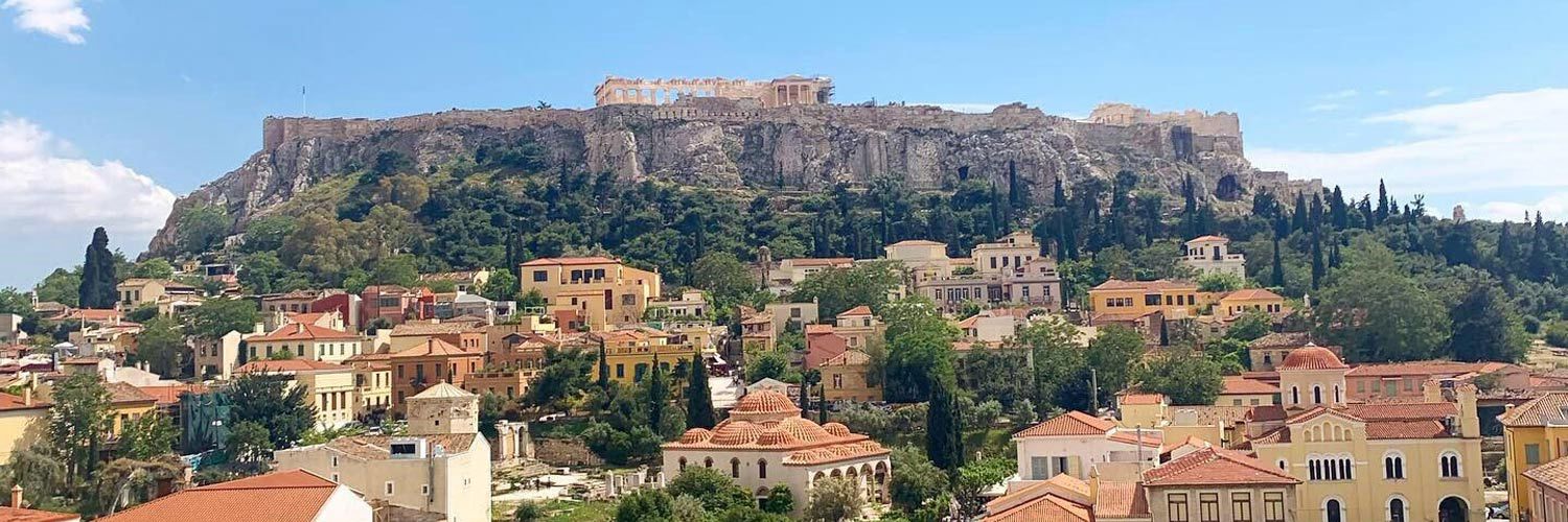 A view of the Acropolis and surrounding buildings in Athens, Greece.