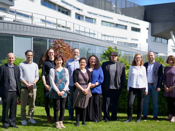 Staff group photo outside QMU 