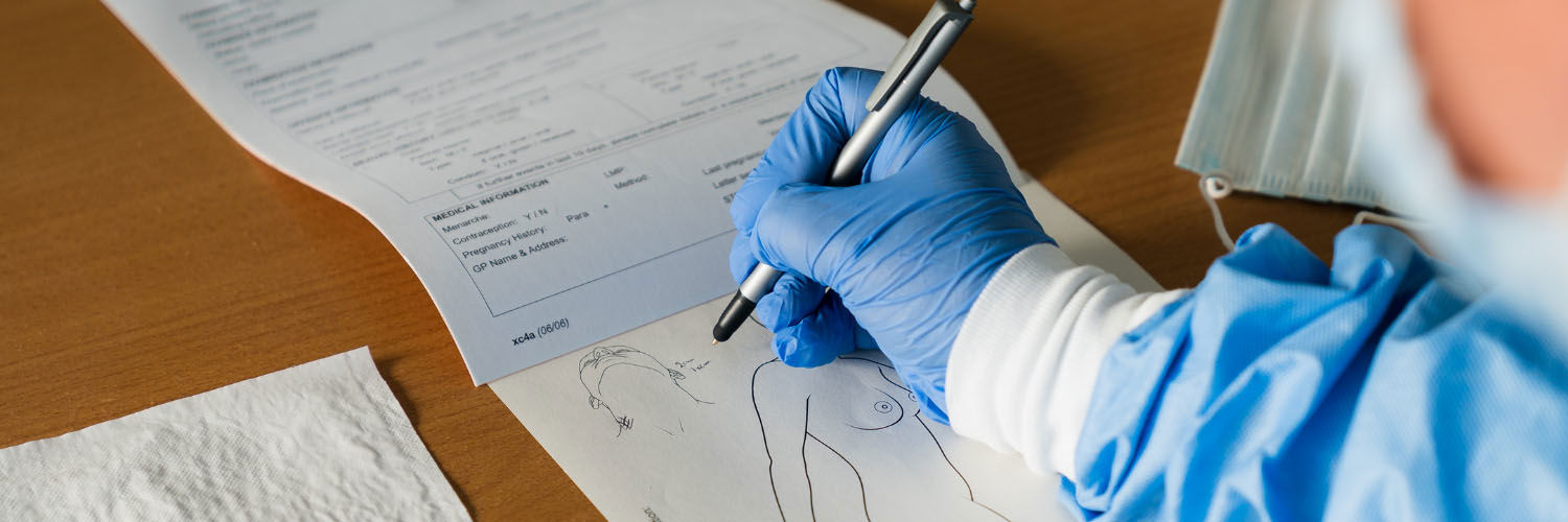 An image of a forensic nurse taking notes