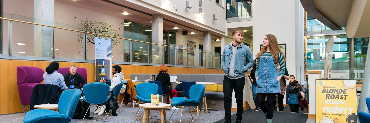 Students walking through the QMU building