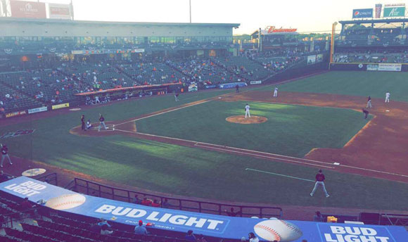 A busy game at a baseball pitch.