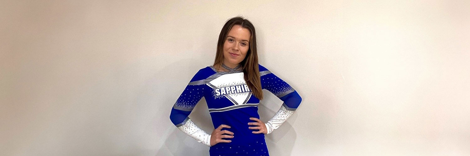 Photo of Rebecca Mcqueen in her QMU Sapphires cheerleading uniform