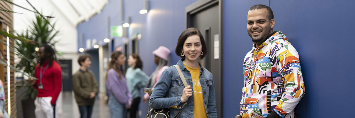 QMU students waiting outside lecture theatre and seminar rooms on campus