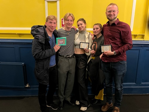 A team of five QMU students hold the awards they won at the 48 Hour Film Project