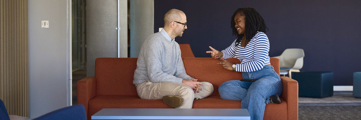 A student speaking to a member of the Student Services team.
