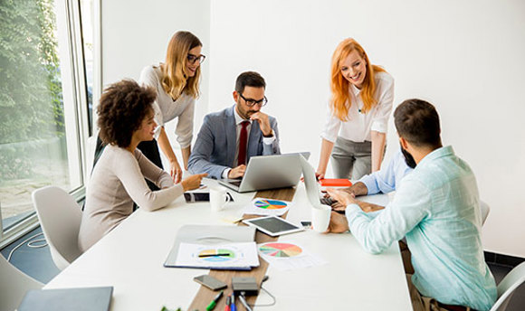 Business people sitting around a desk