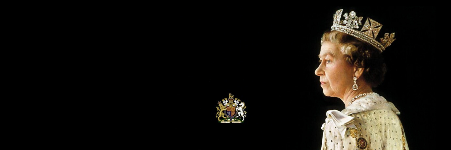 A side image of Her Majesty Queen Elizabeth II wearing a diamond crown and a white robe photographed on a black background
