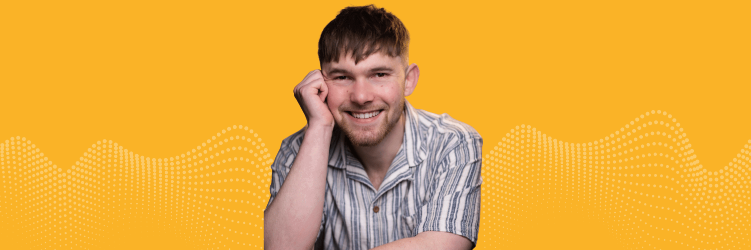 A photograph of Alexander smiling at the camera over a yellow background