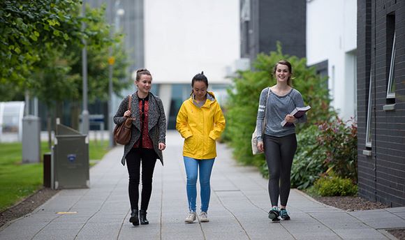 Some QMU students walking on campus