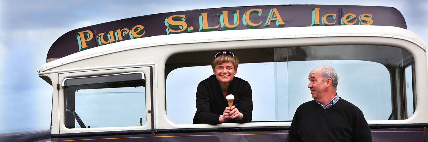 Smiling owners in a Pure S.Luca Ices ice cream van