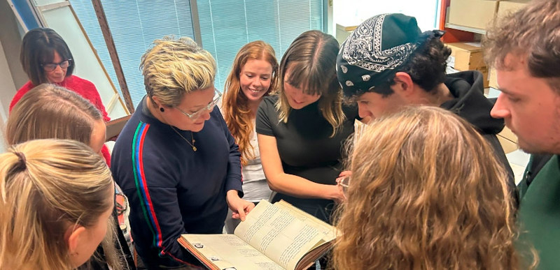 Stef Smith showing some items from the QMU archive with students