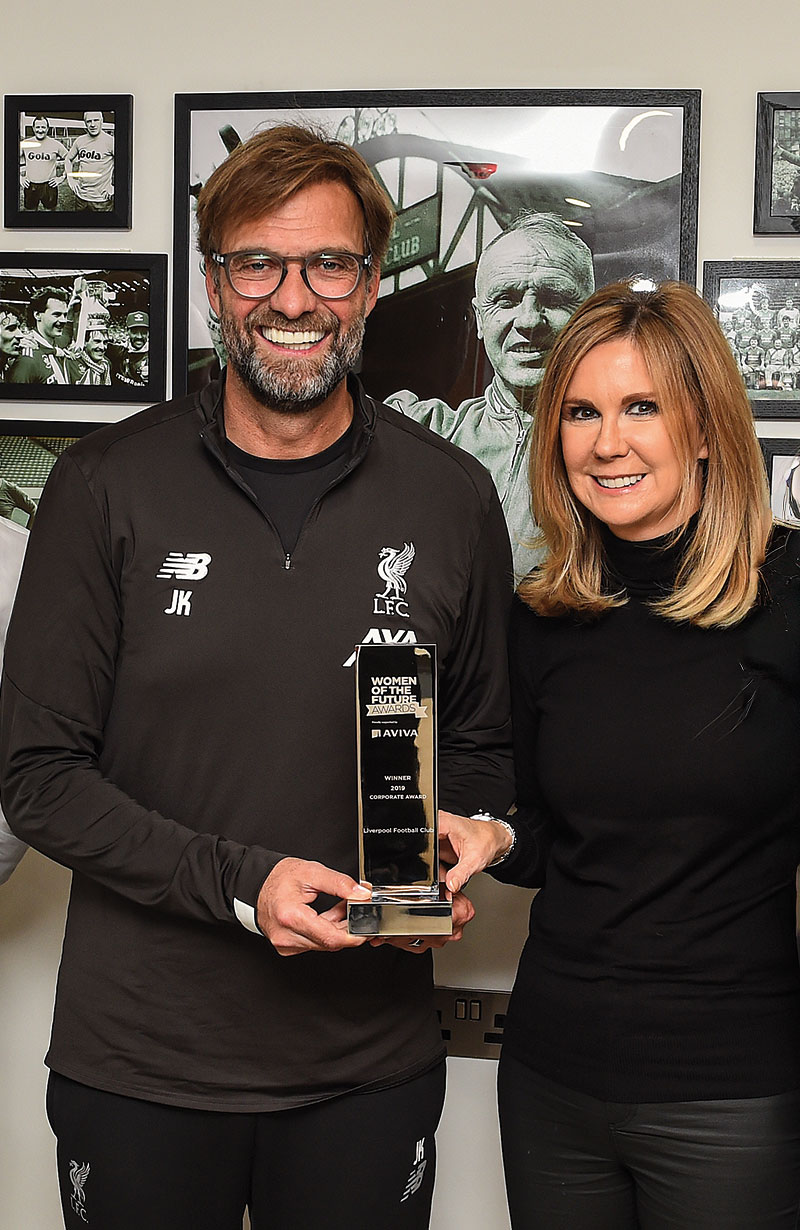 Photo of Jurgen Klopp, former Manager of Liverpool FC, with QMU alumna, Susan Black (Photo credit:  John Powell@LFC)