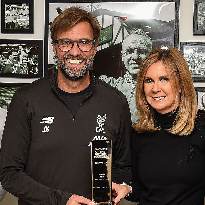 Photo of Jurgen Klopp, former Manager of Liverpool FC, with QMU alumna, Susan Black (Photo credit: John Powell@LFC)