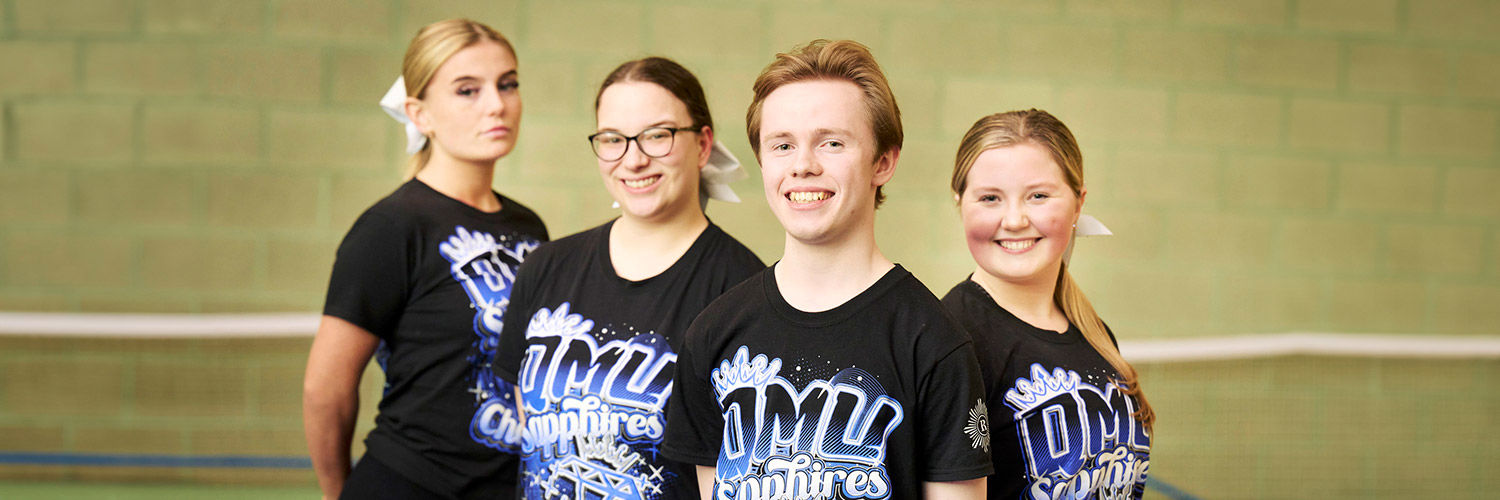 Four QMU Sapphires cheerleaders
