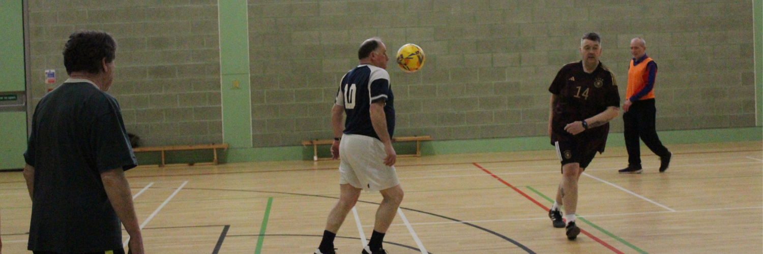 Four men playing walking football
