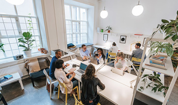 Group of creative people working together in a modern office