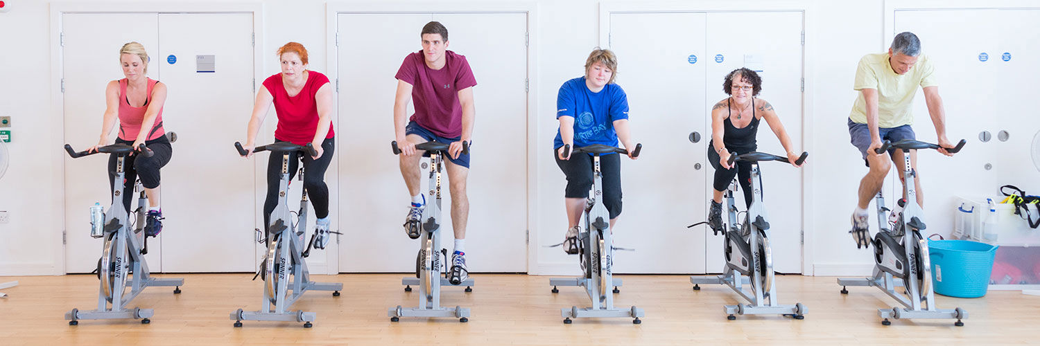 A busy spin class in session in the QMU sports centre