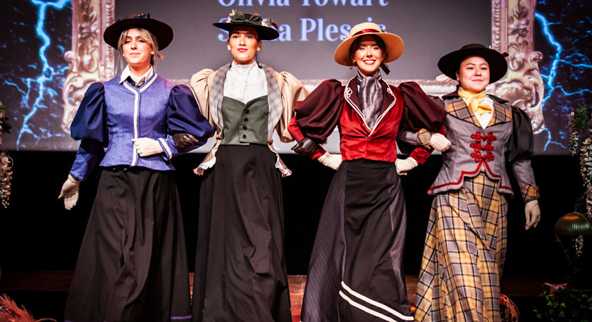 Students on stage in costumes